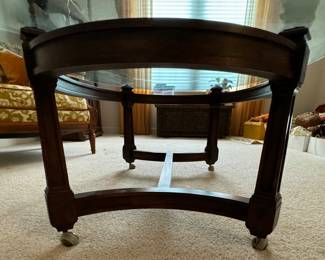 Vintage Oval Wood & Glass Top Cocktail Table On Casters. Measures 46.5" x 30" x 17" H. Photo 3 of 3.