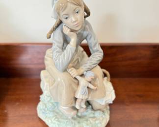 Lladro Girl with Doll. Photo 1 of 2.