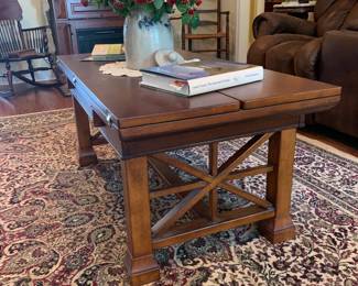 Expandable coffee table with flip down sides 