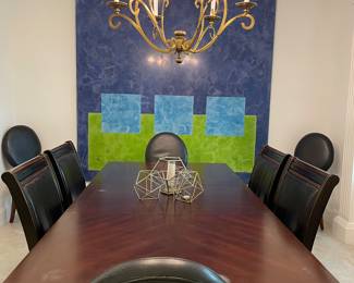 Large dining table with leather chairs.  
