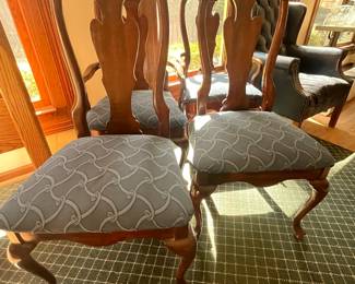 Four wood and upholstered dining room chairs 