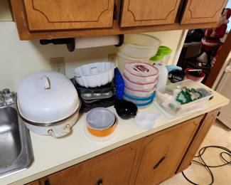 Pots and pans along with kitchen storage