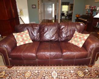 One of 2 leather sofas