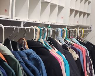 shoe shelves and lots of mens and womens clothing