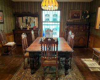 Matching dining room set, including 8 dining room chairs and dining room table, armoire, sideboard cabinet with attached mirror, framed artwork, tabletop decor items
