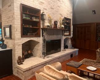 Brass decor, vintage book collections/sets, clock, wooden sculptures, collected eclectic decor.