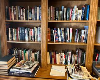 Multiple shelves of WWi and WWII books and Magazines and more.  Also religious, and Oregon Trail books