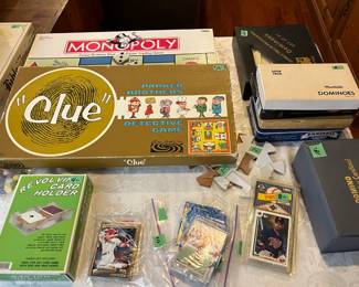 Games.  Pristine condition Monopoly, Clue, Pictionary, Dominoes, Baseball cards, playing cards, etc