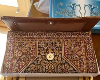 Tapestry clutch 