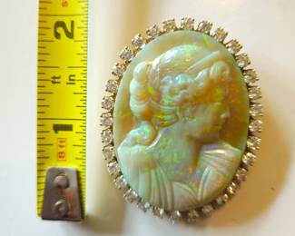 Fabulous carved opal set in 18k surrounded by 3 carats of diamonds. Wear as a pendant or booch. Early to mid 20th century. Priced far below retail value in Anna Miller's Cameo guide book.