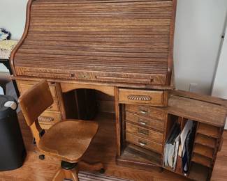 Roll top desk w secret storage, original matching chair.
Rolls easily. Perfect condition 