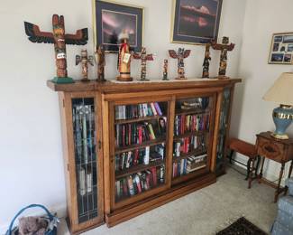 Bookcase with stain glass doors. 
Impressive Totems made by Alaskan Native Americans/Inuit People. Each is signed by the artist. 