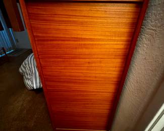 Mid century disguised file cabinet (see next photo for open state) . Lock and key included. Rollaway opening to expose full file cabinet. 