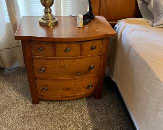 Part of a four piece bedroom set with king bed frame