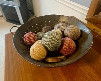 colander with fabric balls 