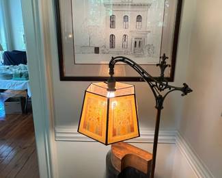a 1930's screen shade iron base floor lamp