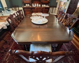 Walnut and Mahogany Dining Room Furniture, a large dining table and a set of ten mahogany Chippendale dining room chairs