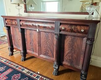 an antique mahogany Empire claw foo sideboard