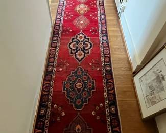 a very long antique Oriental Rug runner