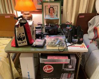 The back room has an odd mix of cameras, loose photos, framed pieces, linens and Johnny Depp;)