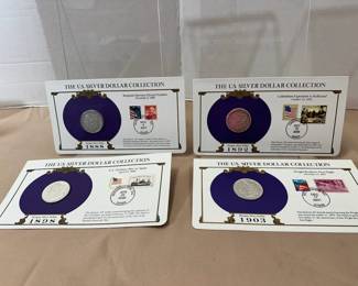US Silver Dollar Collection with commemorative stamp