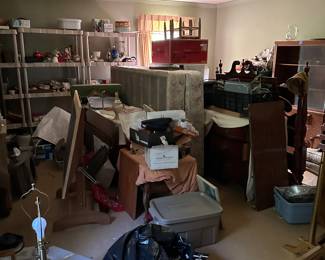 A room packed full of cool stuff!!  We still have this room to empty and stage. 