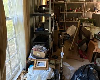 A room packed full of cool stuff!!  We still have this room to empty and stage. 