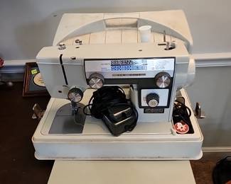 New Home Sewing Machine model 592
Accessories at front desk