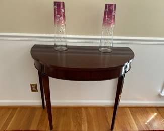 Demilune table and antique vases