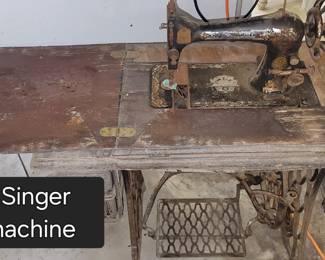 Ver old Singer sewing machine (cabinet wood is pretty rough) 
