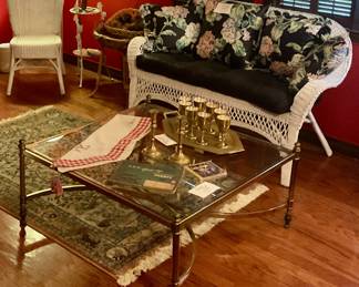 wicker settee and brass and glass table