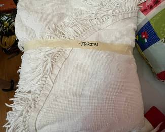 #210	Twin cream colored bed-spread	 $25.00 
