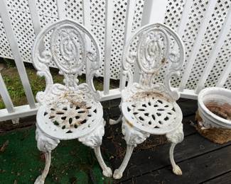 #52	Pair cast iron chairs 	 $150.00 
