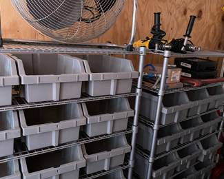 Wire racks with plastic bins.