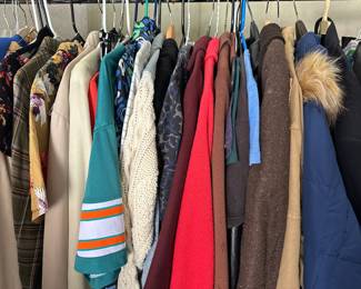 Mix of vintage and modern clothing, including dresses, blouses, jackets, leather coats, gore-tek rain gear, sports jerseys, belts, purses, etc.
