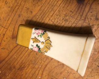 Vintage salt shaker with floral accouterments