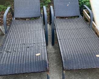 #75 - $80 	Pair of black loungers chairs 
