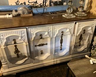 #55 - $80 	White painted vintage chest 9 drawers - not wood 
	64Wx16Dx32H with 2 mirrors 21Wx46H
