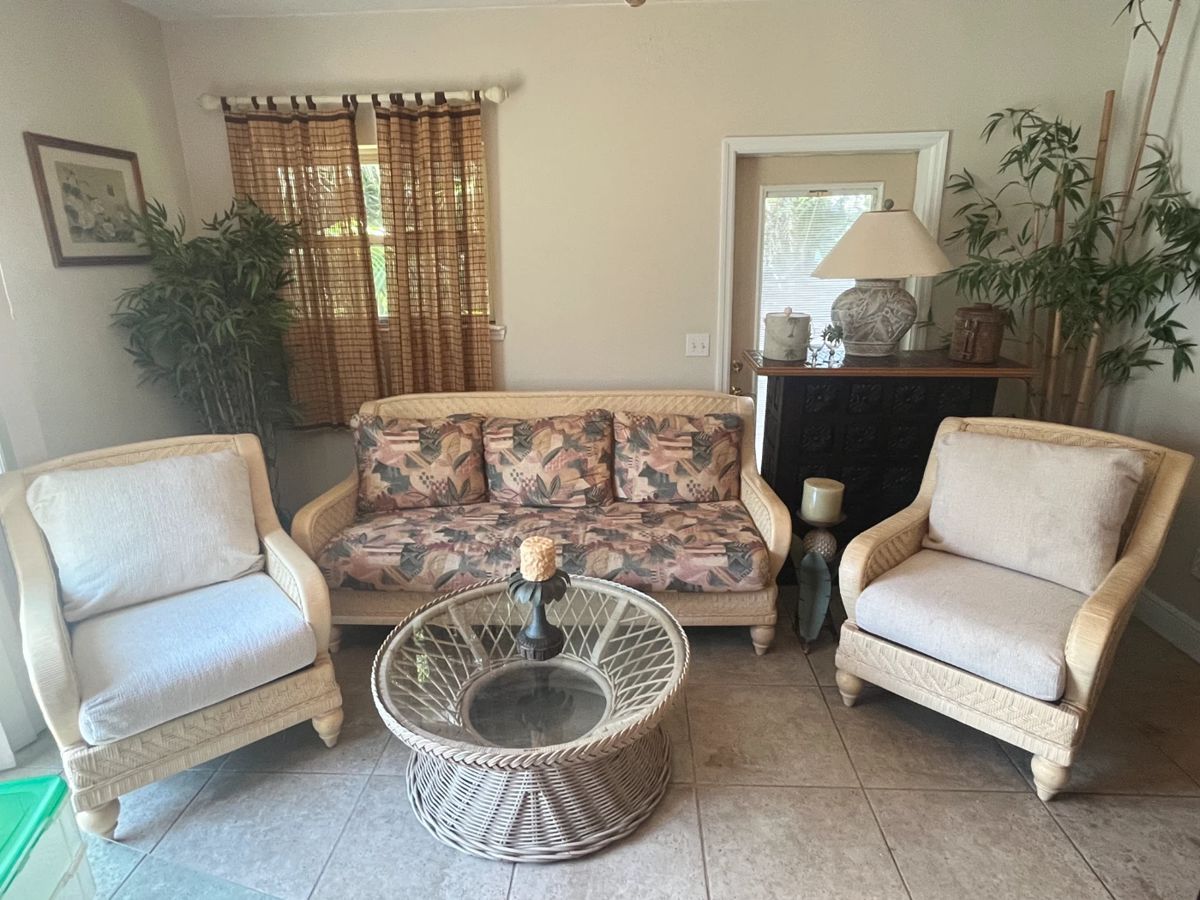 Wicker sofa 76", pair of wicker chairs 29.5", round glass top wicker table 36"