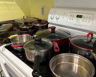 Lots of pots and pans and kitchen equipment