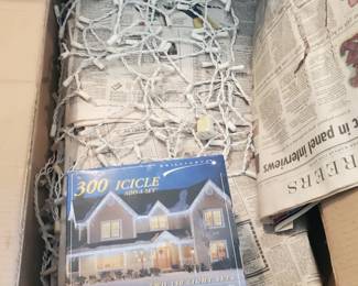 2 Boxes of Icicle Lights with Clips on them. approx 200 feet. 1 New Box of 300 Icicle Lights
