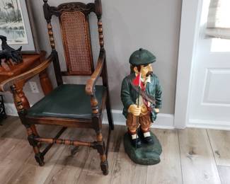 ANTIQUE ARMCHAIR AND GOLFER