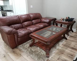 LEATHER SOFA, GLASS TOP COFFEE TABLE AND MATCHING END TABLES