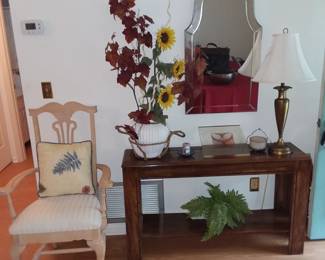 Sofa table with decor, wall mirror 