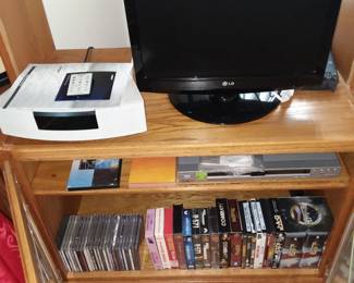 DVD and VHS movies, music CDs, Bose system, TV