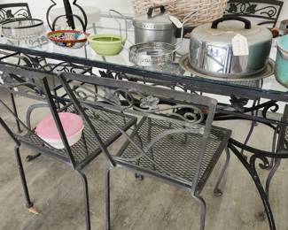 Vintage wrought iron and glass patio set