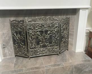 Pretty silver fireplace grate.