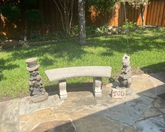 Cement bench and cute statuary.