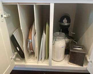 Standing Kitchenaid mixer, misc cutting boards and trays.