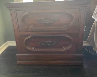 Bedside table that matches king headboard, triple dresser and armoire.